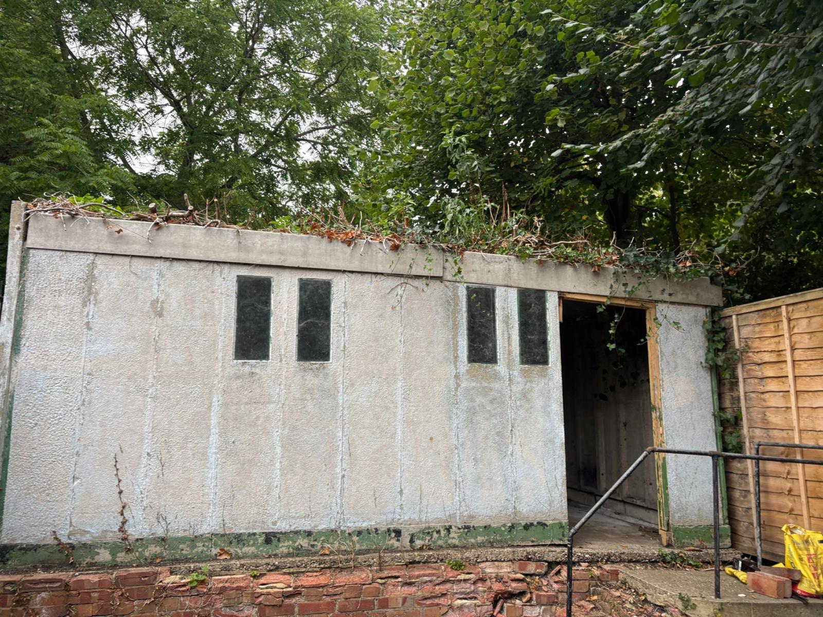 Old concrete panel garage before removal